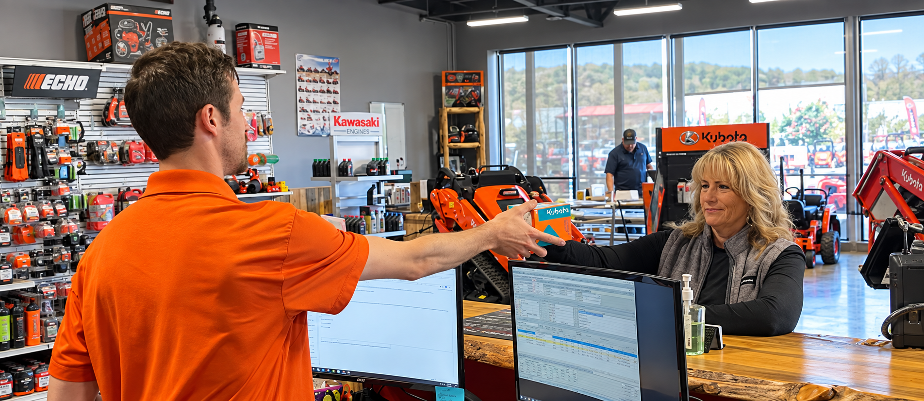 RIMSS team member handing a part to a customer at the dealership parts counter